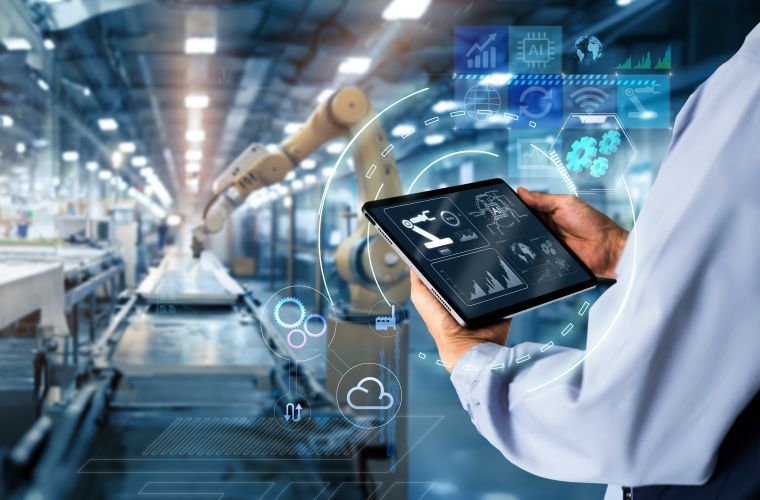 Smart industry control concept.Hands holding tablet on blurred automation machine as background